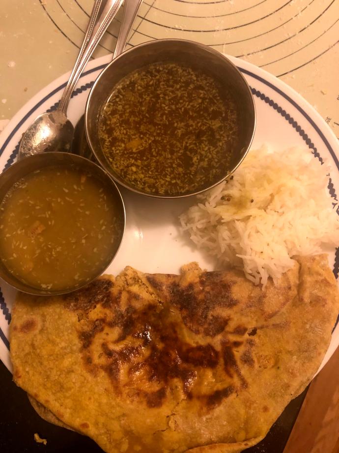 Katachi Aamti next to the rice, hanging out with friends—Ambat Goad Varan and Puran Poli!